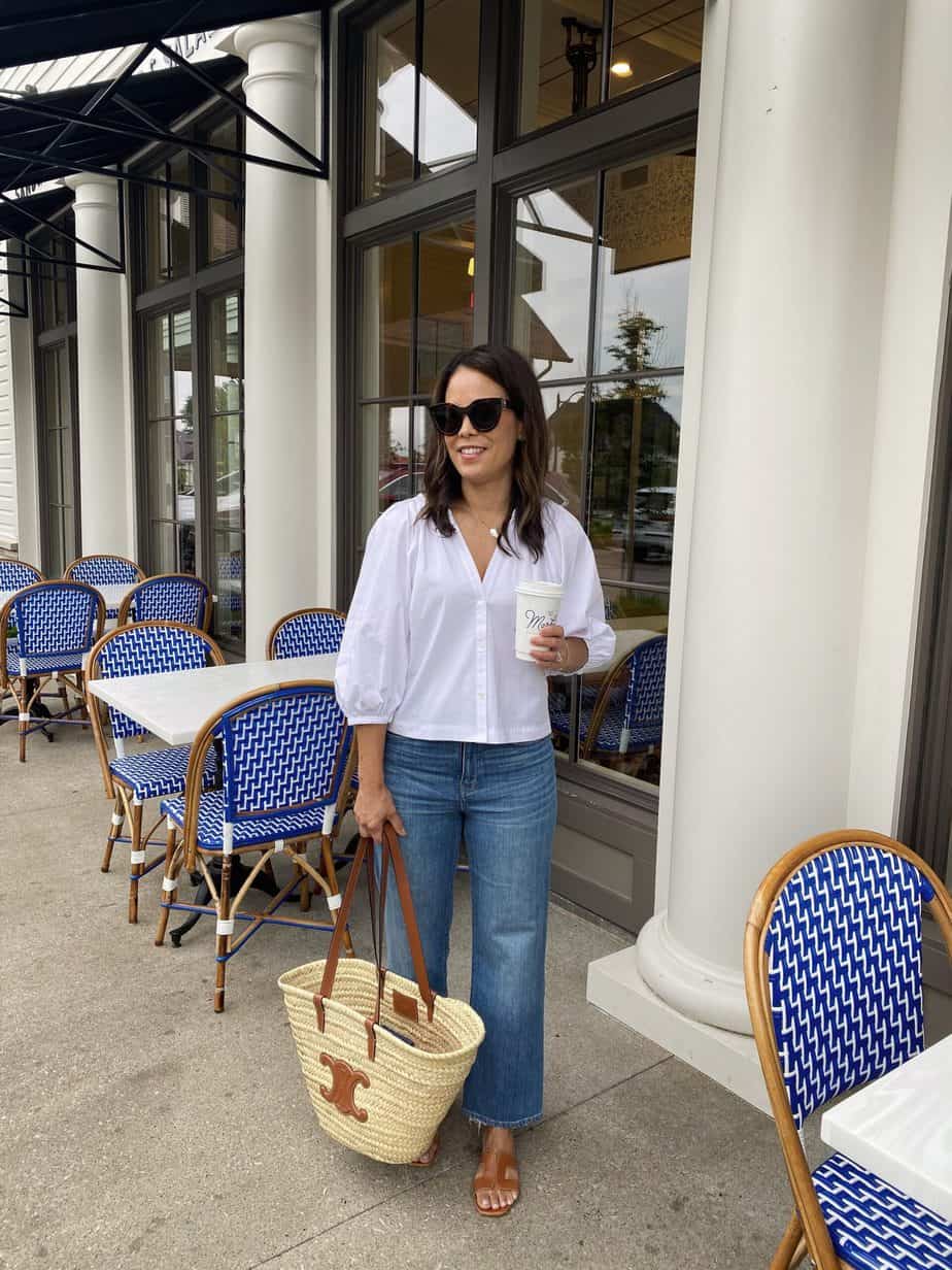 wearing jeans, shirt, and sandals