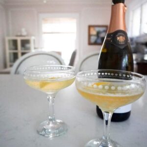 French 75 cocktails in a coupe on a counter