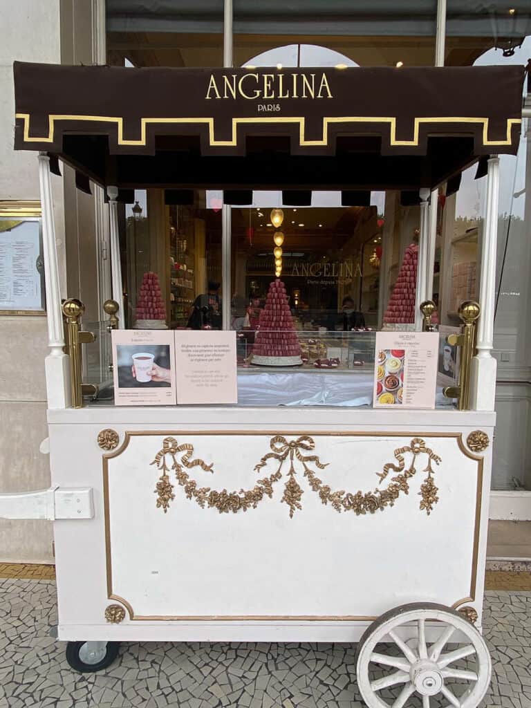 Brown and white cart in front of Angelina in Paris 