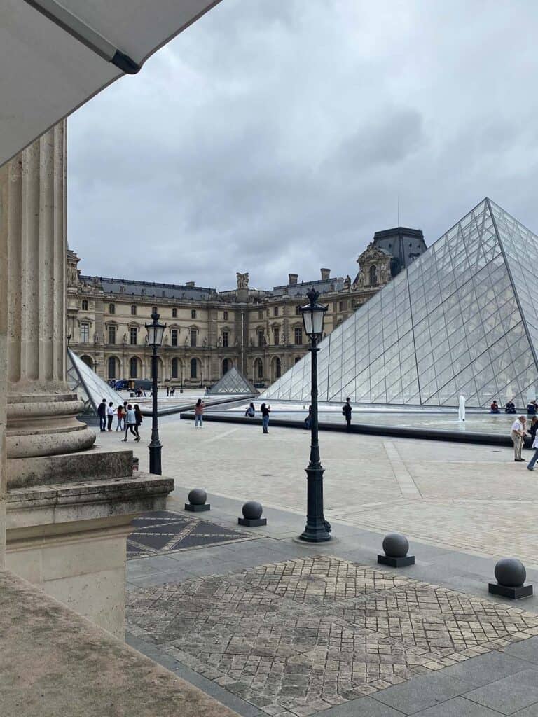 Looking out into the louvre pyramid from cafe marly 