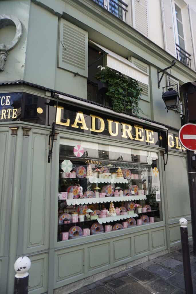 Laduree on the corner in Saint German des Pres Paris, Green storefront. 