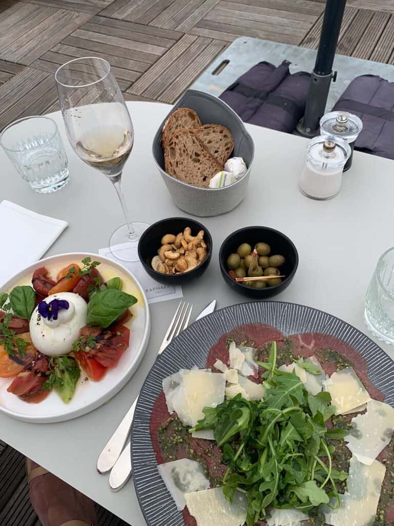beef carpaccio and buratta with heirloom tomatoes in paris