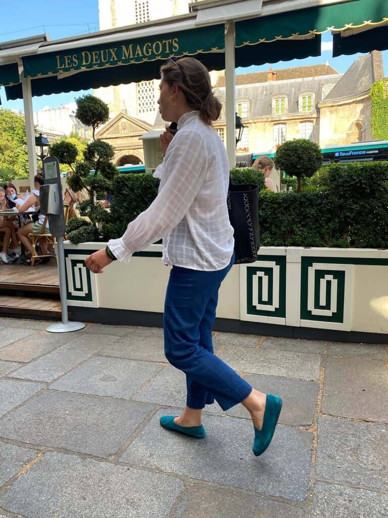 Parisian woman walking with green flats