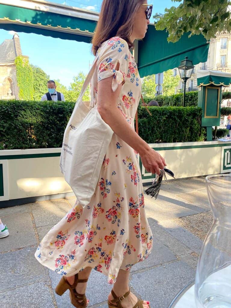Parisian woman in a dress on the streets walking