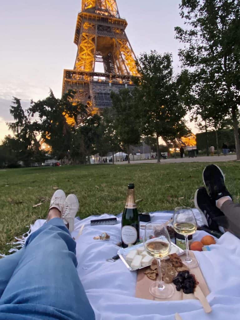 Picnic at the Eiffel Tower showing our feet in the background