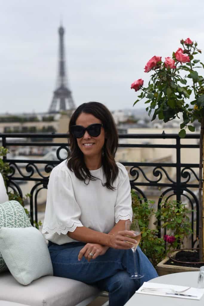 sitting in a bench on the rooftop of hotel raphael in paris