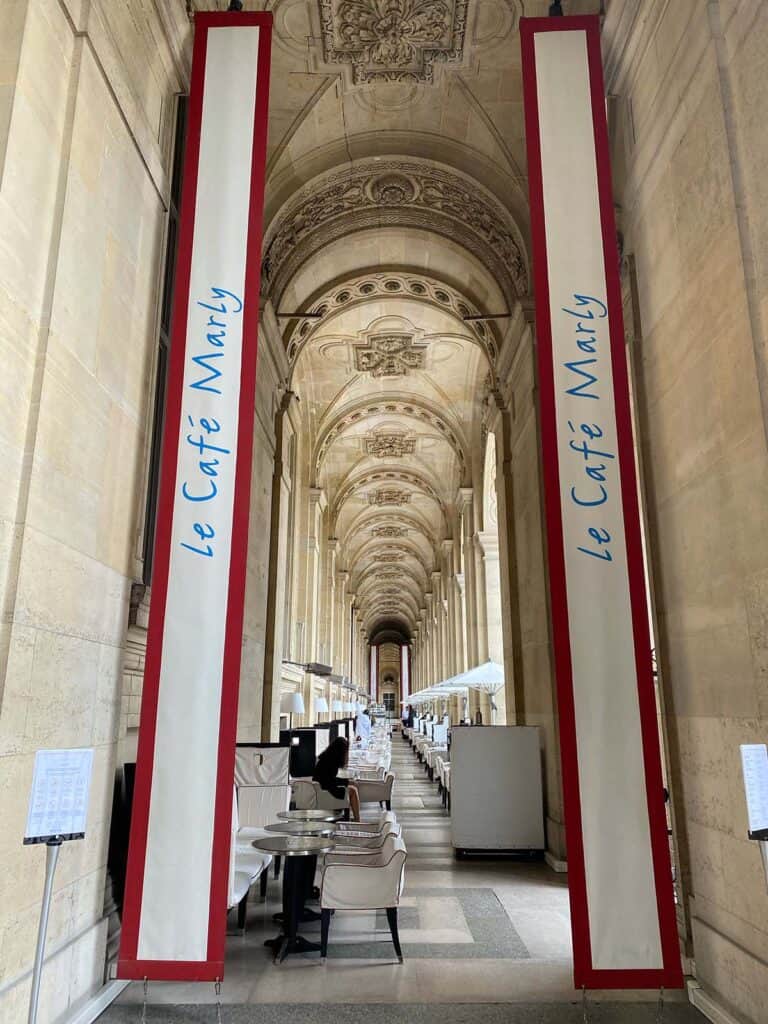 entrance to cafe marly in paris