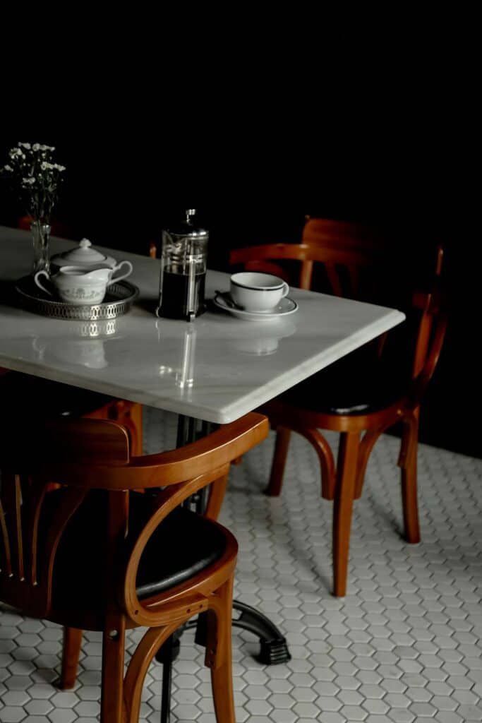 white marble Bistro table and chairs in a restaurant