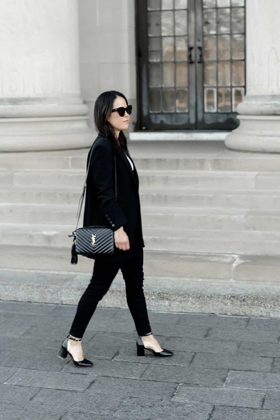 Black jeans, black blazer, white tee, black pumps and black handbag