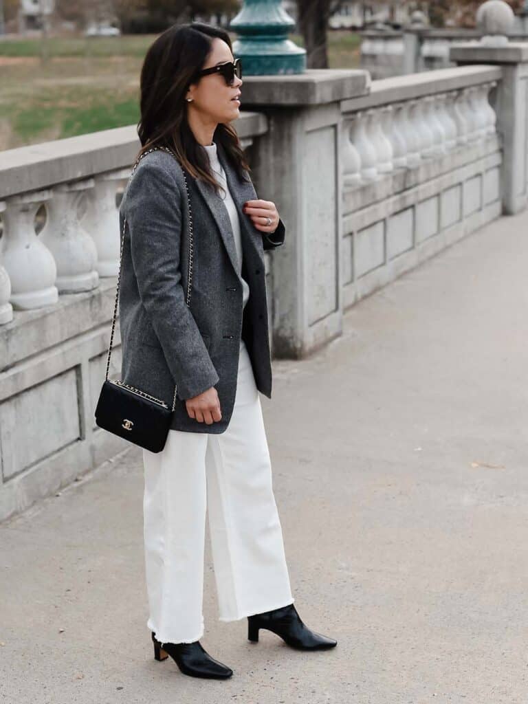 me standing wearing grey blazer and white jeans