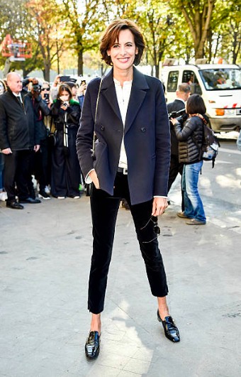 French woman wearing navy blazer and black pants together