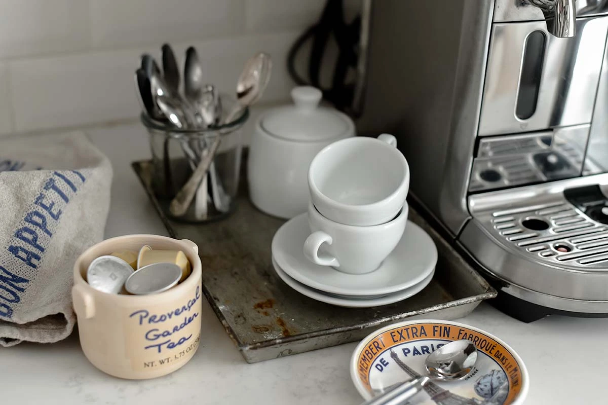 Nespresso Maker sitting on counter with espresso cups
