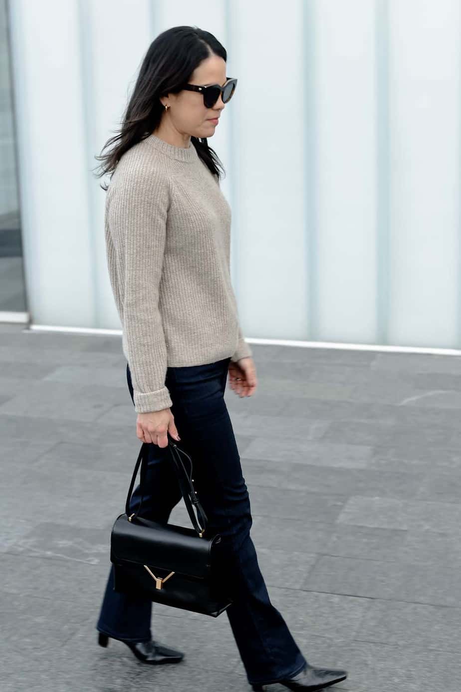 Shot of side angle walking with dark jeans and sweater