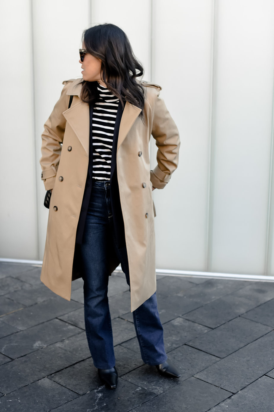 wearing trench coat and stripes with jeans