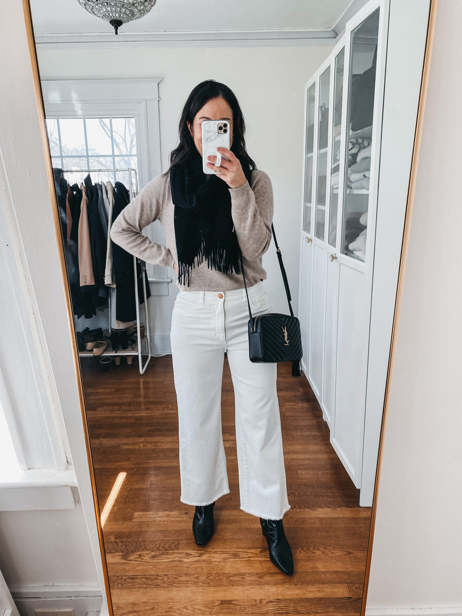 wearing white jeans, sweater, black scarf, booties