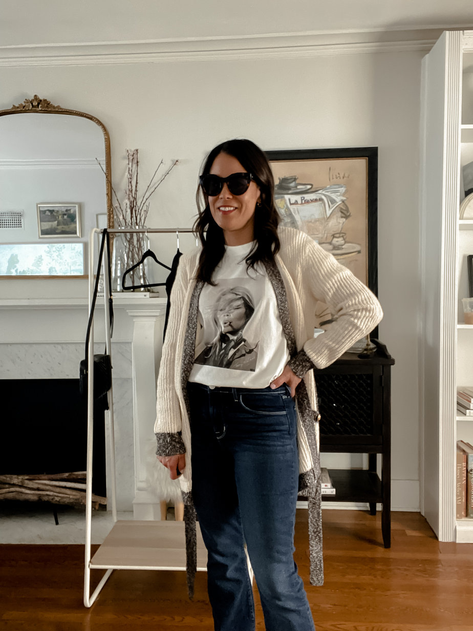 wearing cardigan, graphic tee, sunglasses, jeans 