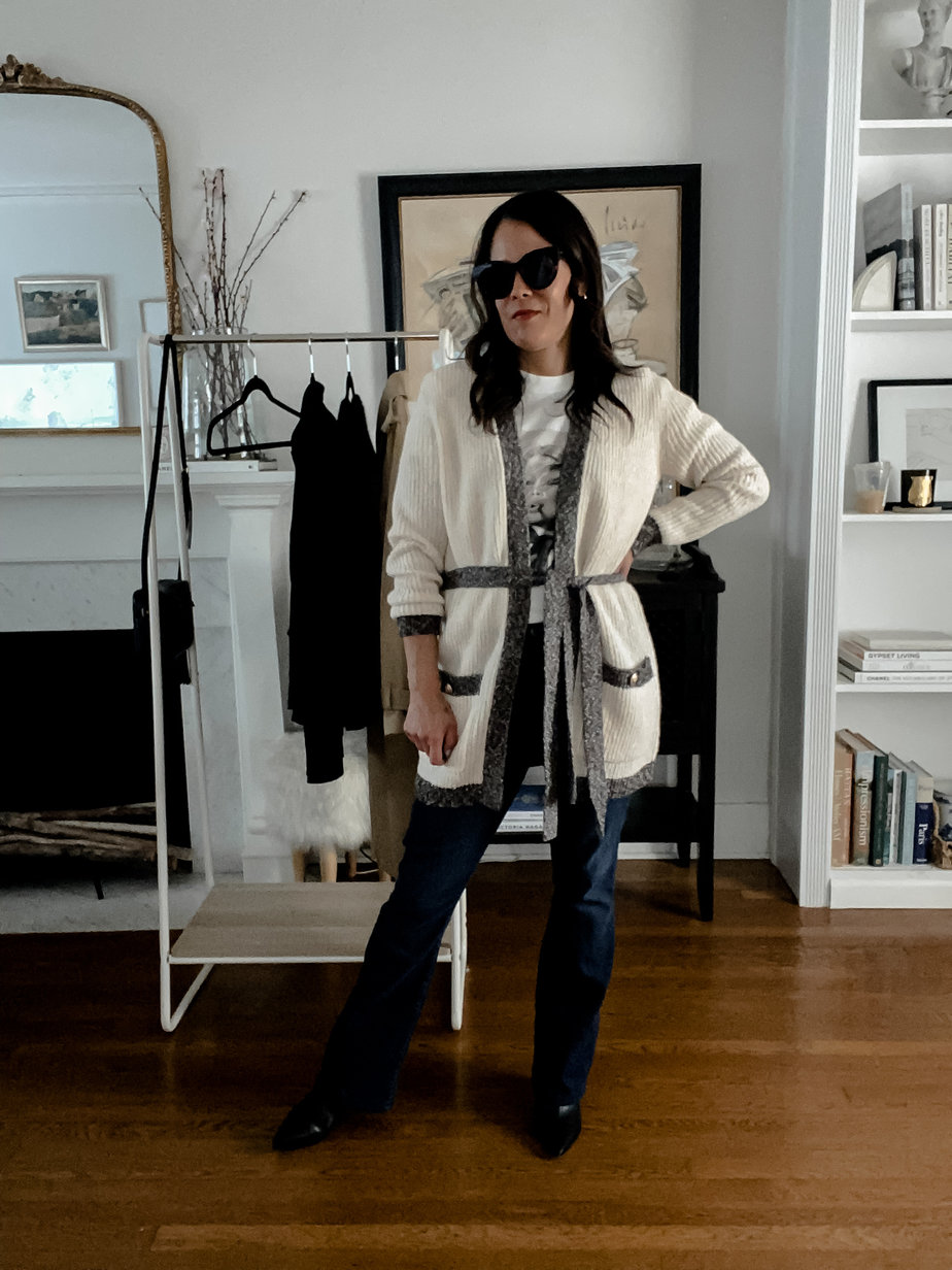 wearing cardigan, sunglasses, jeans 