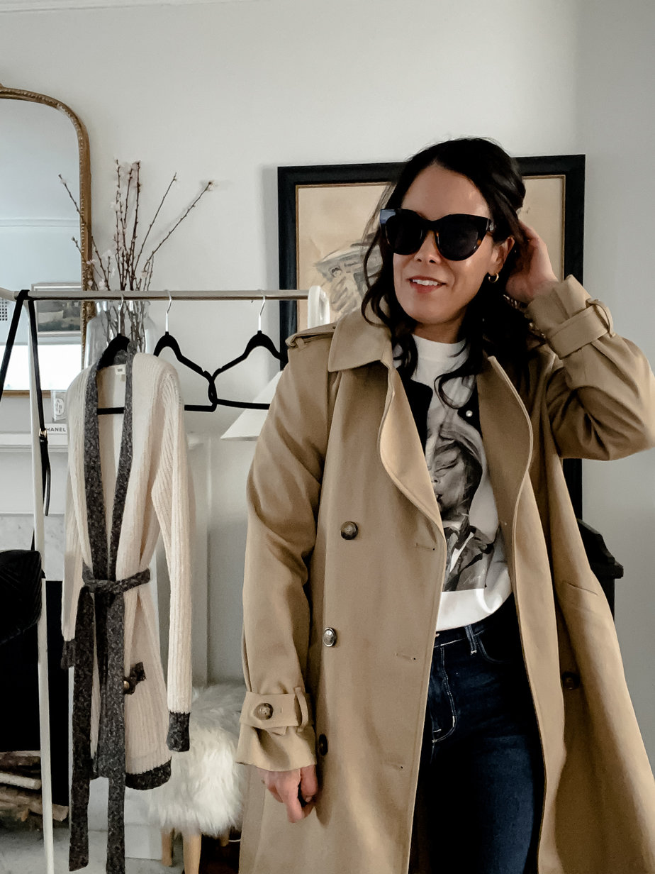 wearing trench coat, graphic tee,sunglasses 