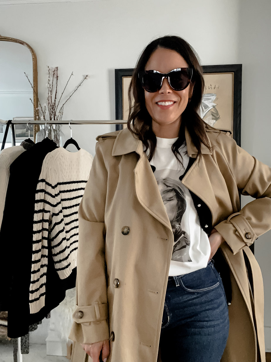 wearing sunglasses and a trench with anine bing tee 