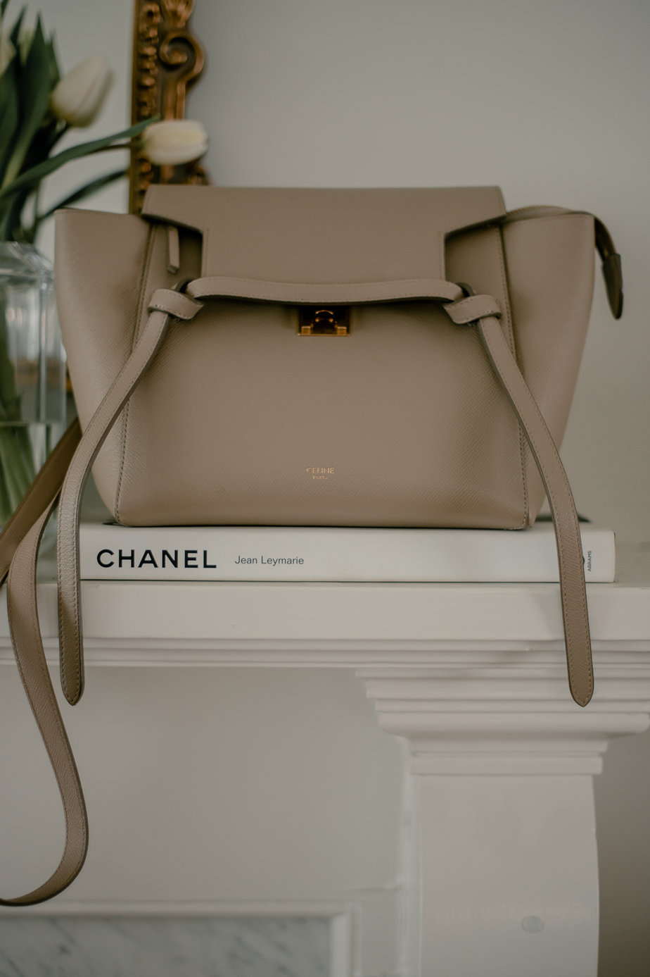 celine micro mini belt sitting on fireplace 