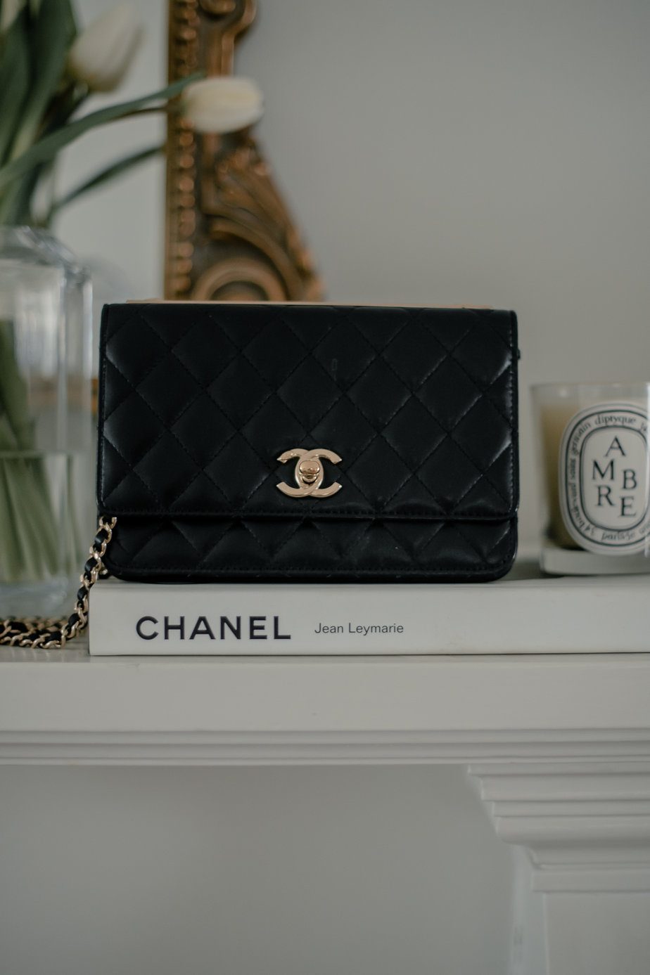 chanel wallet on a chain on a fireplace 