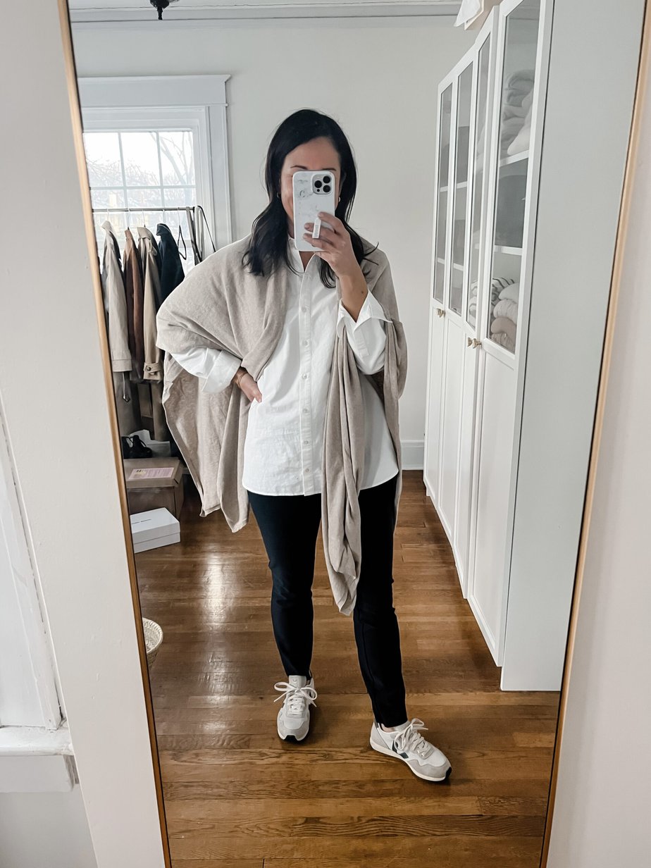 wearing white button down, leggings, sneakers 