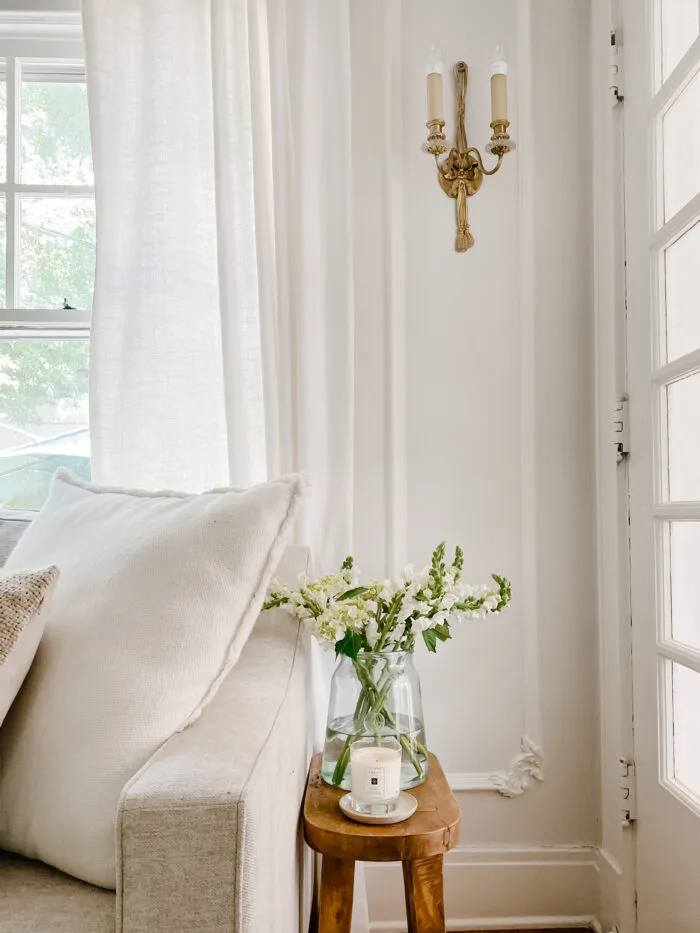 flowers in a vase in corner or a room