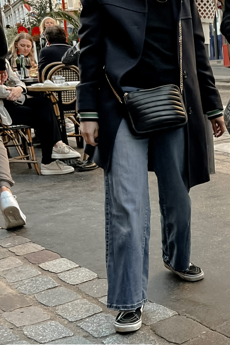 Woman with Jeans, Black Sneakers, Navy Coat in Paris