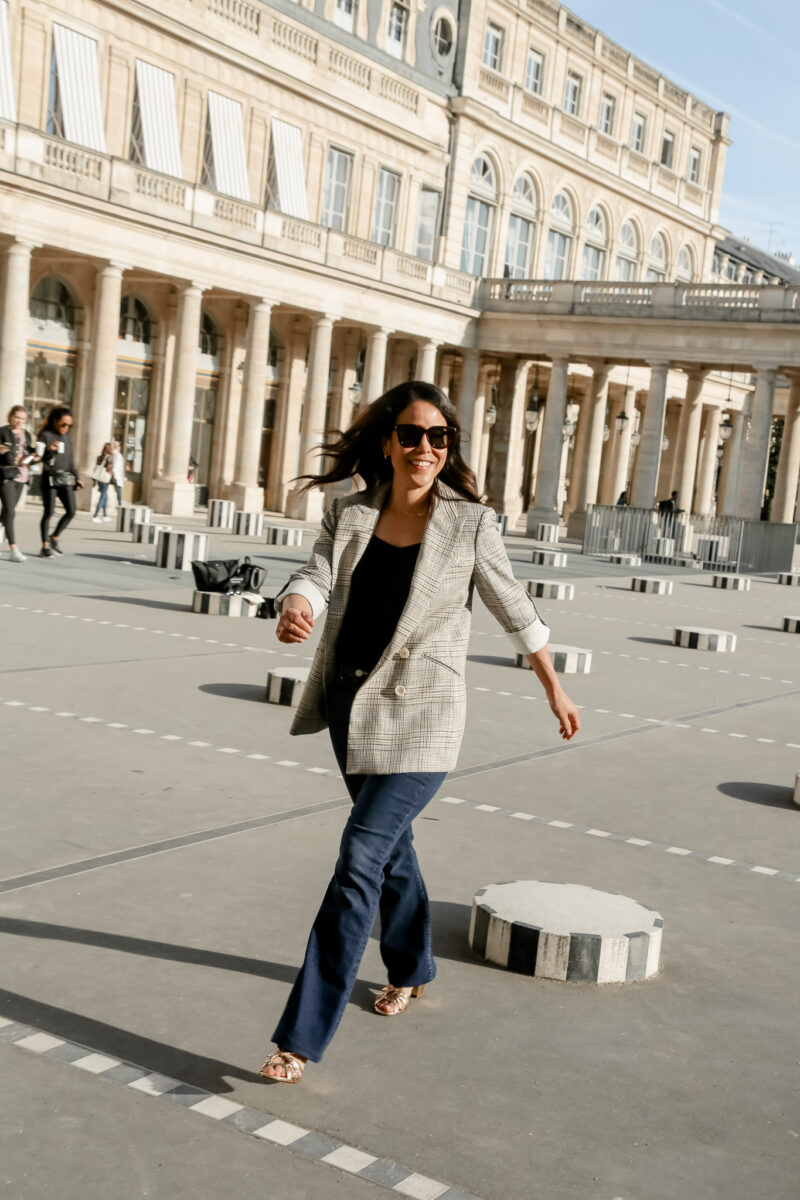 wearing jeans and blazer in palais royal in Paris