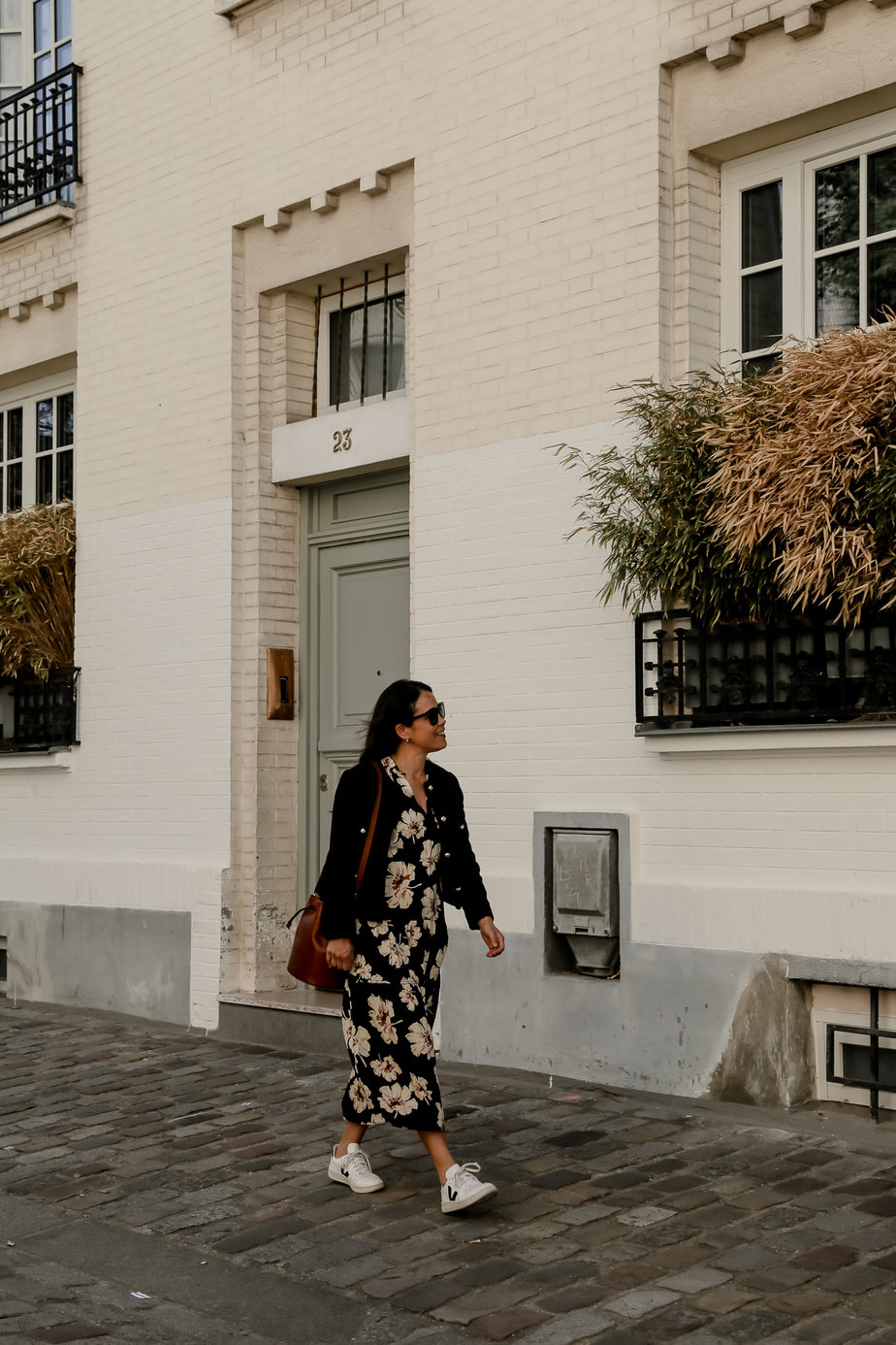 midi dress and white sneakers outfit wearing dress and jacket walking in montmatre