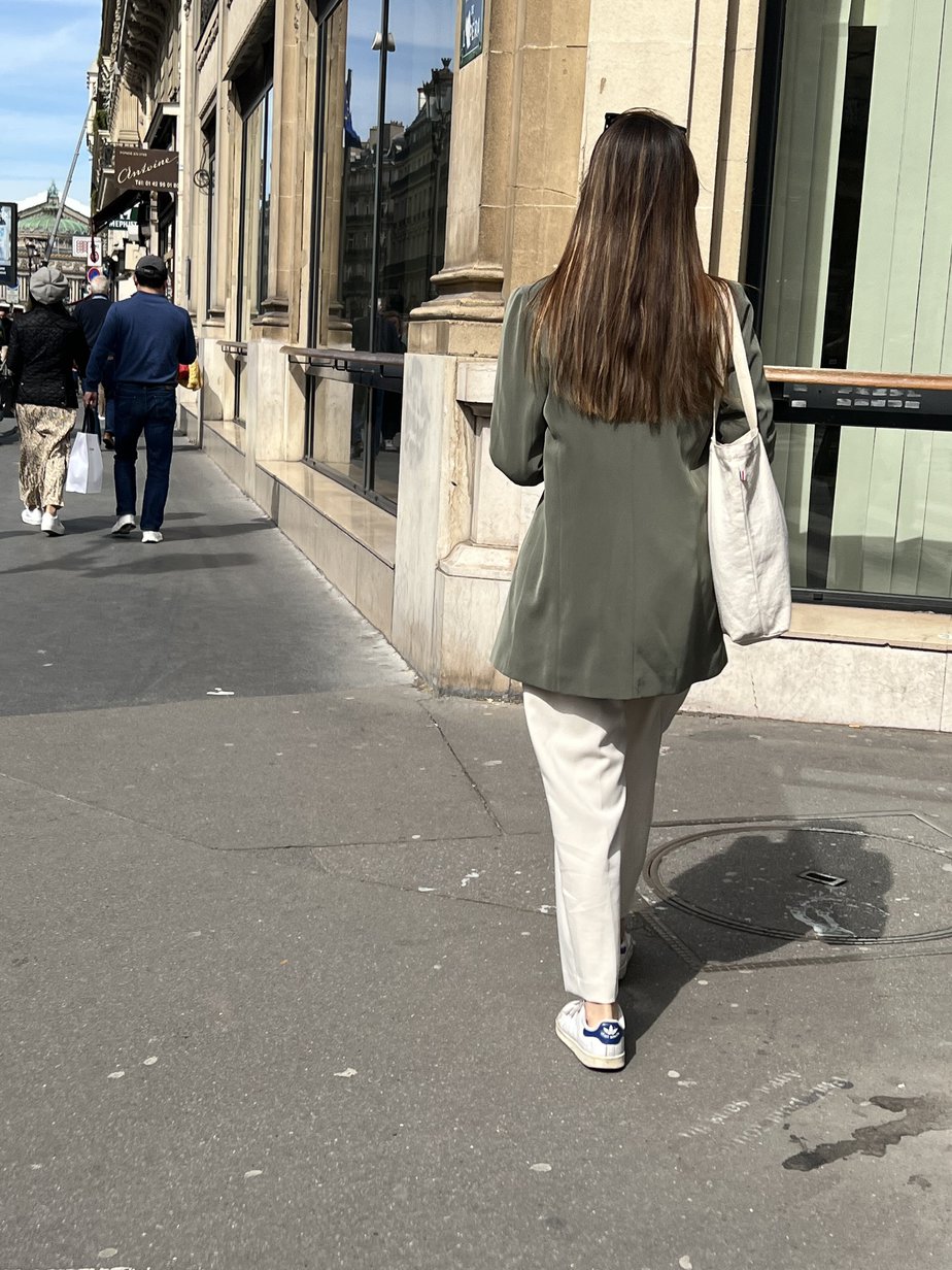 adidas sneakers in paris girl with blazer, jeans, and sneakers in Paris
