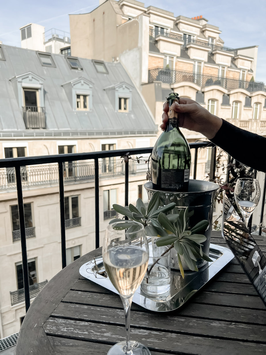 champagne bottle and coupe on table
