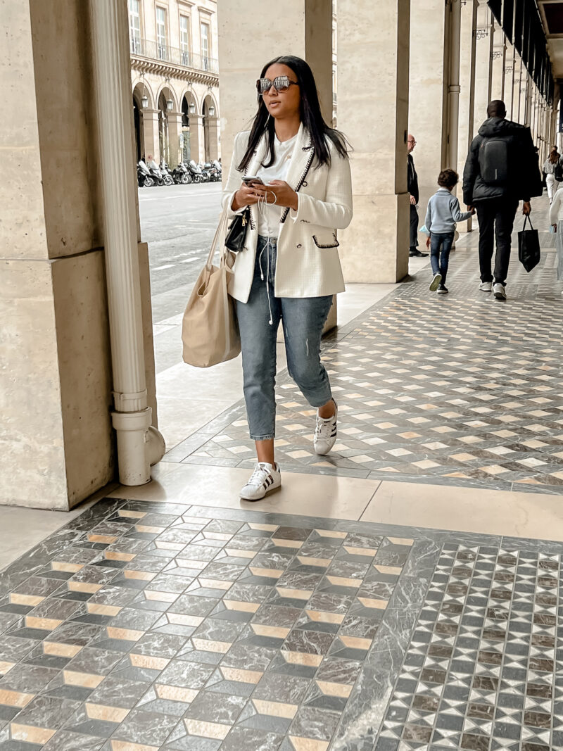 girl walking in Paris with sneakers
