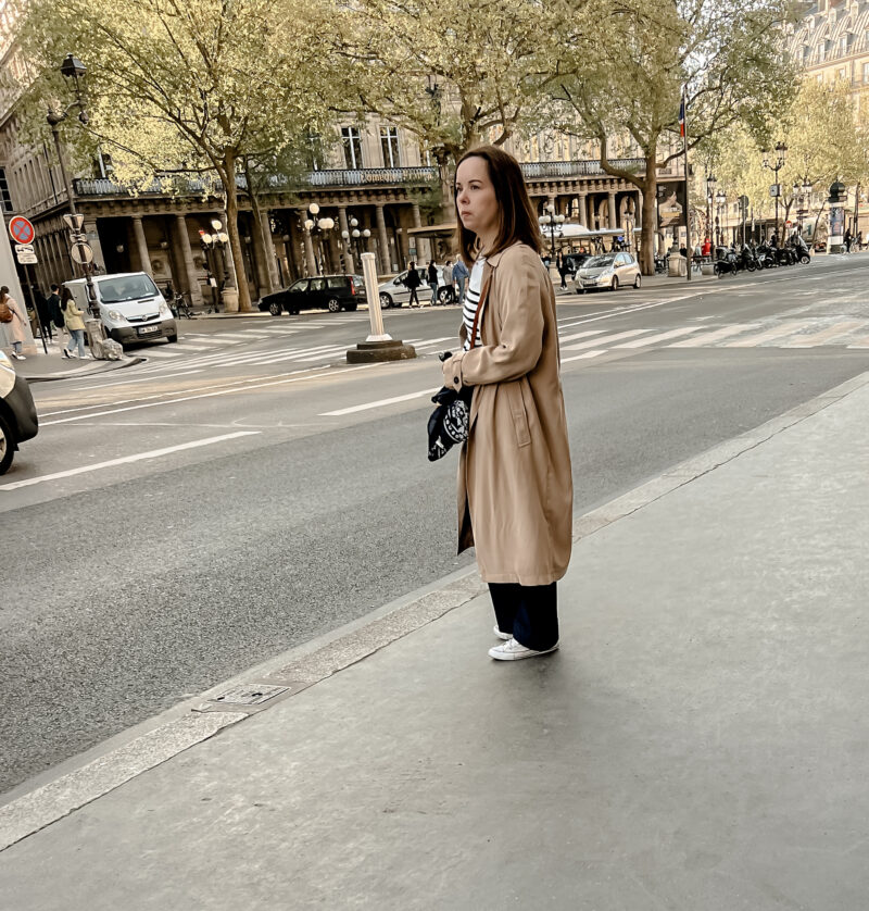 girl with trench coat and stripe shirt in paris