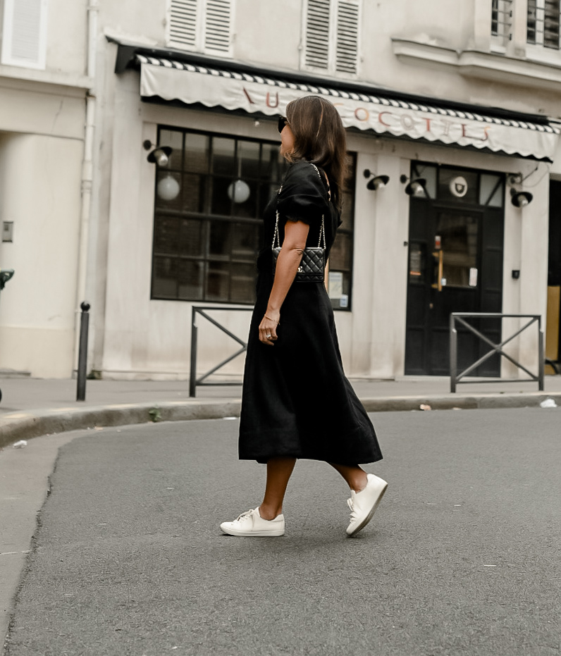 SĆØzane Jack Trainer review walking on a street with black dress and white sneakers