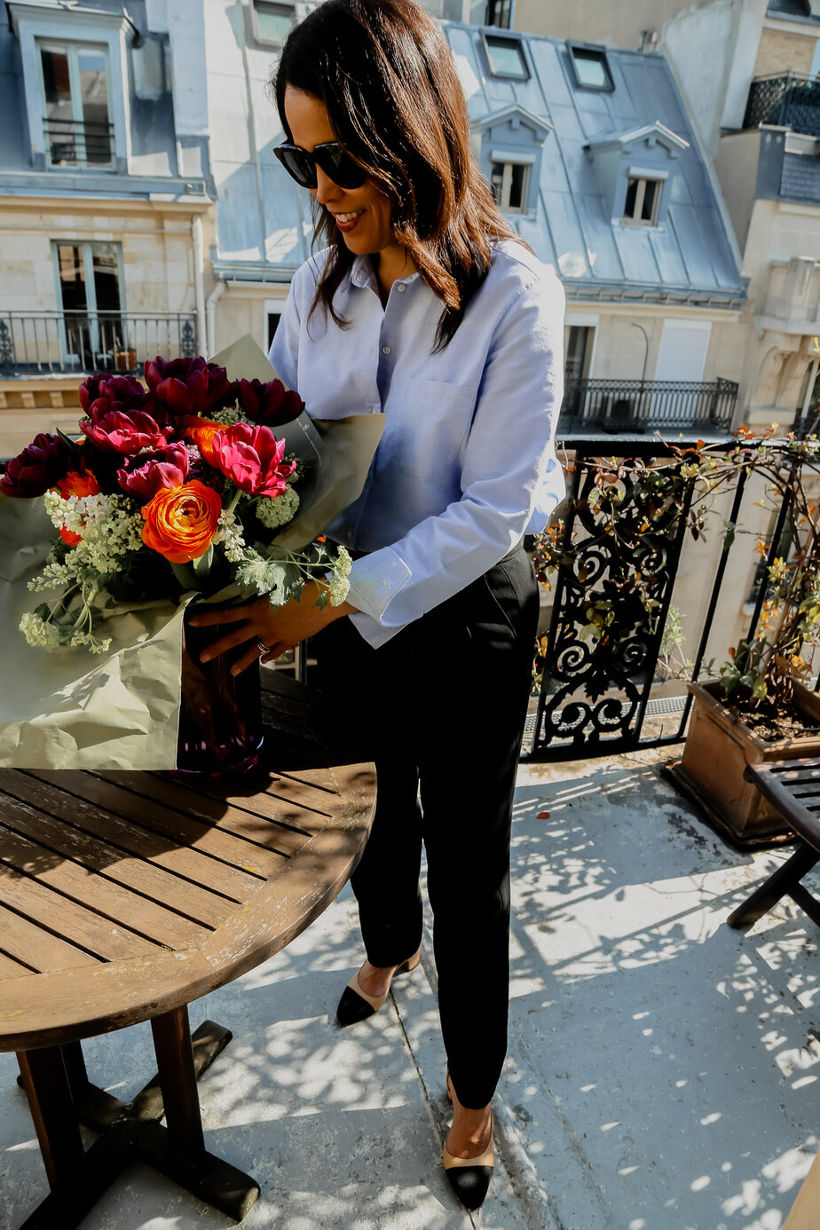 standing over flowers in paris