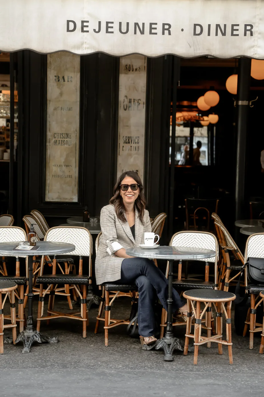 sitting in blazer at les antiques cafe in paris