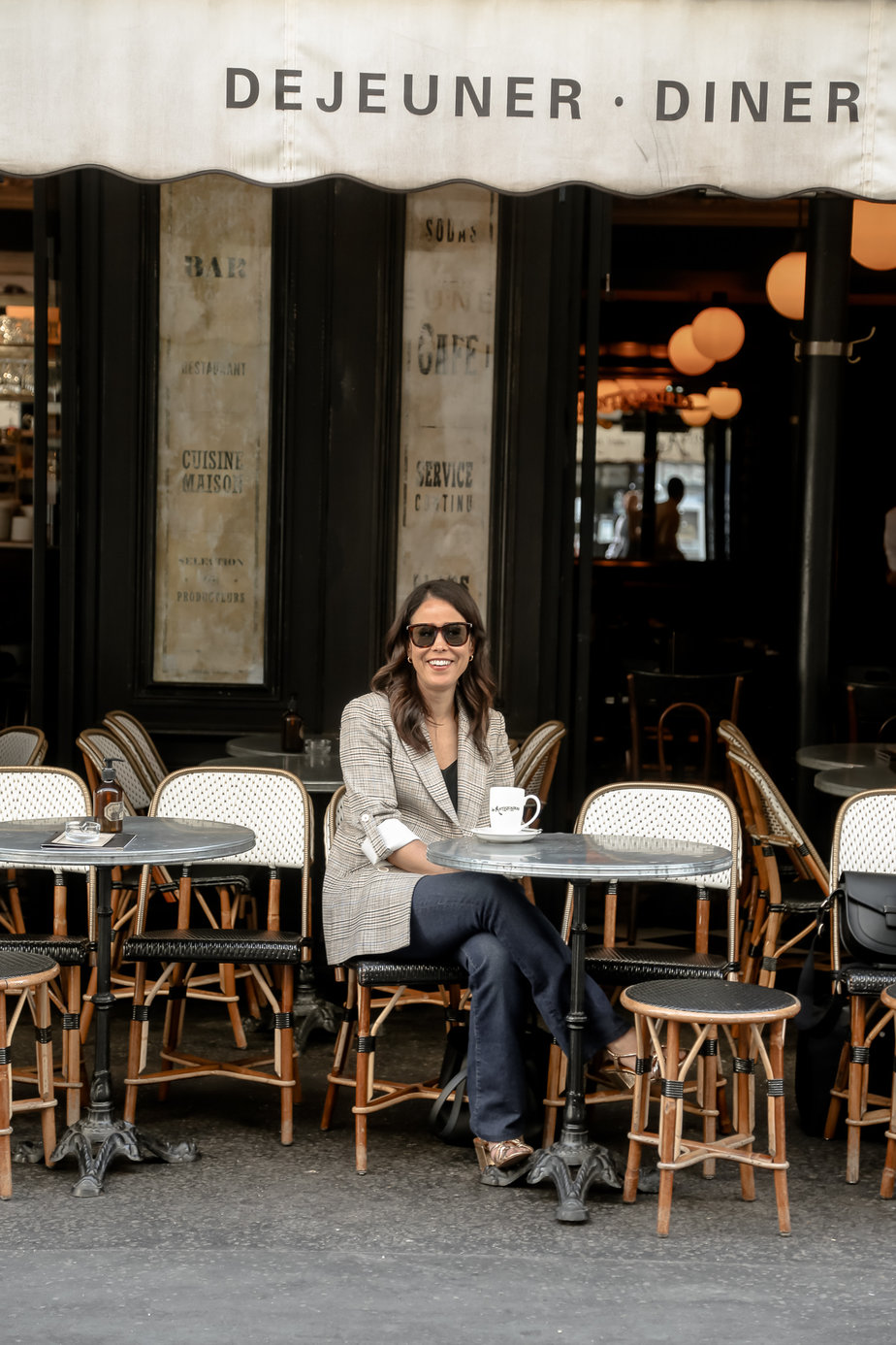sitting in blazer at les antiques cafe in paris