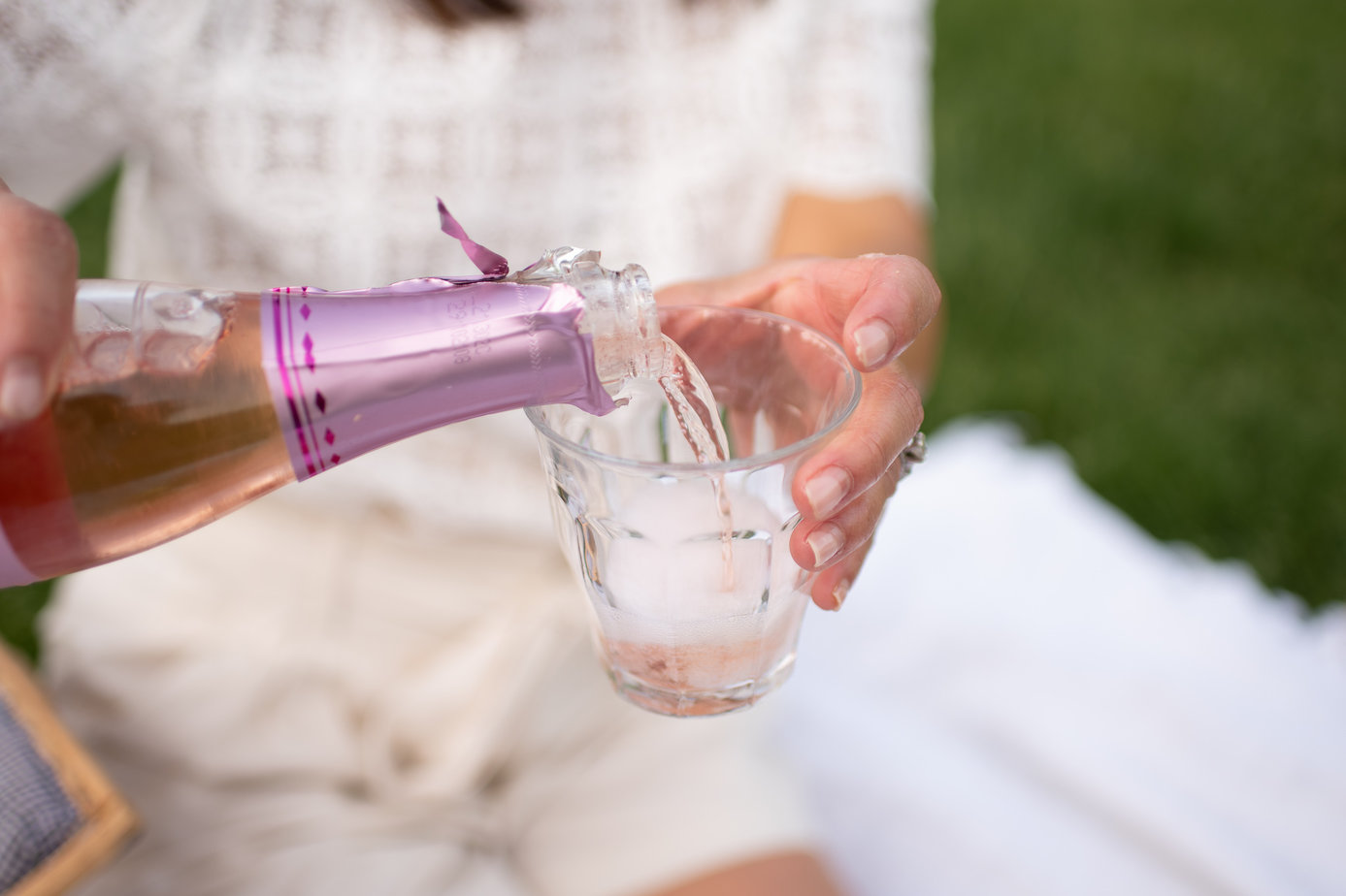 pouring a bottle of champagne