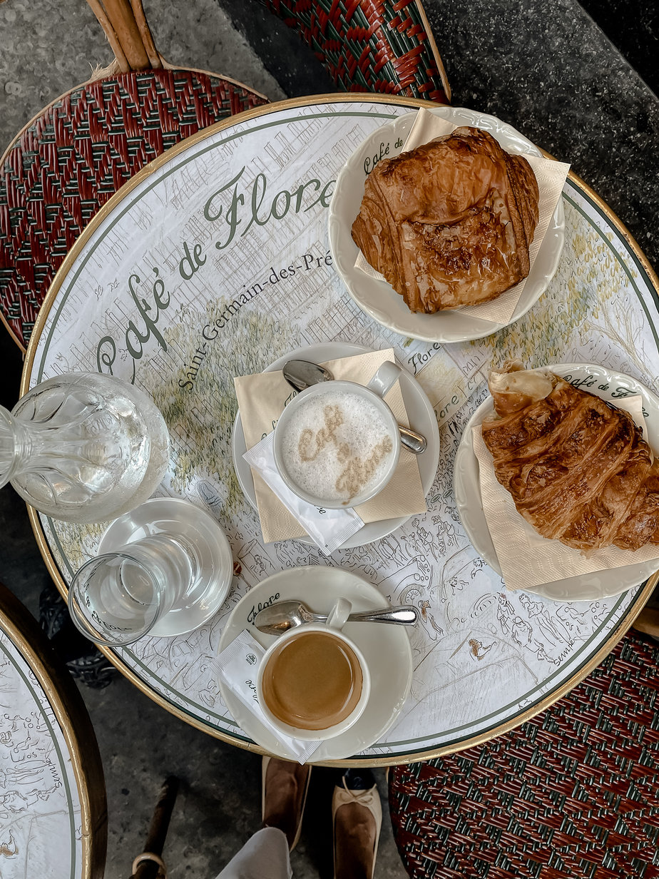 croissants and coffee on table at Cafe de Flore