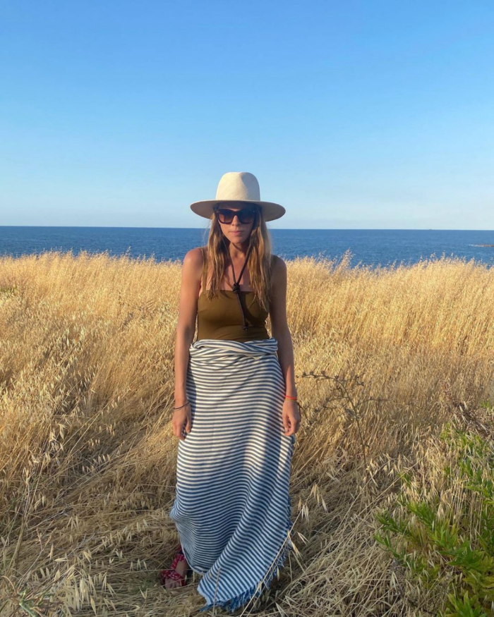 monica de la villardiere in swimsuit and hat