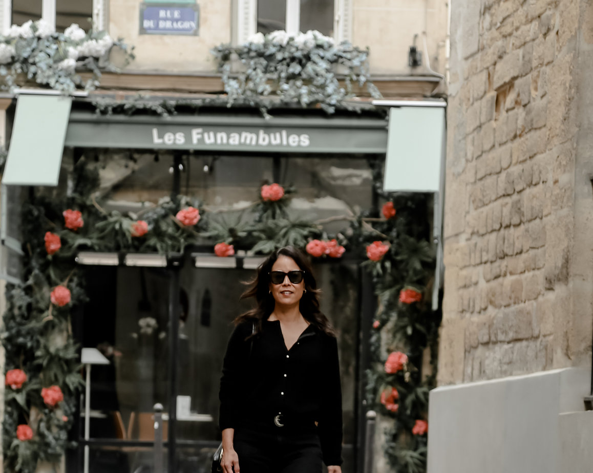 Wearing Sèzane Gaspard in Black in Paris Walking Down The Street With Flowers