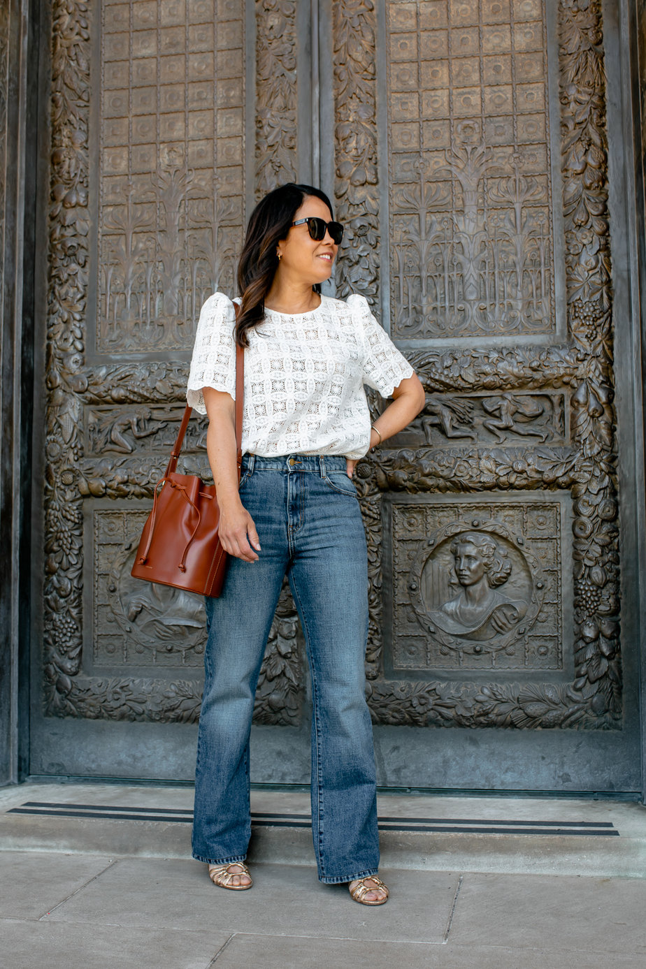 White Top with Jeans White Top with Jeans, standing in front of museum door