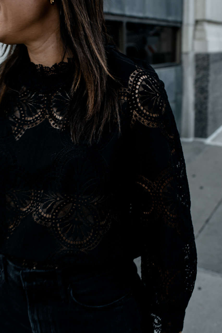 Wearing black top walking down the street