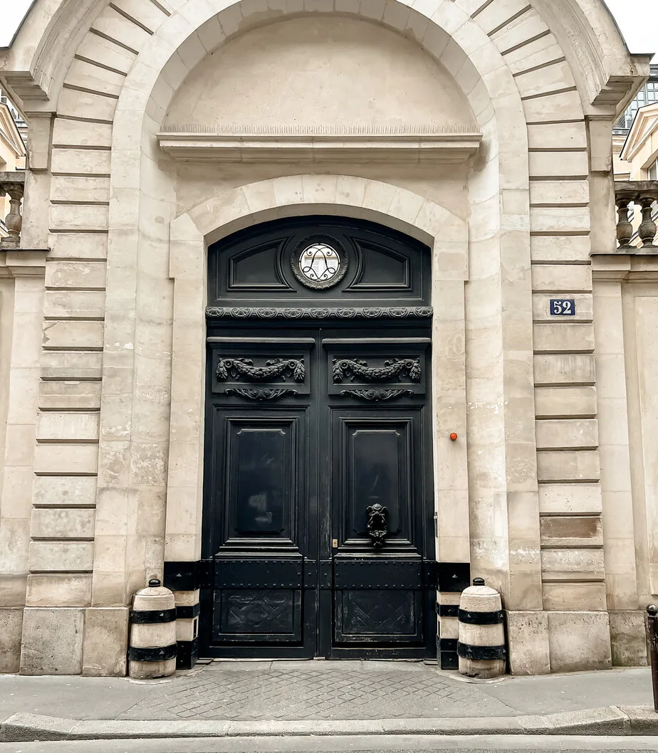 Black door in Paris with huge archway