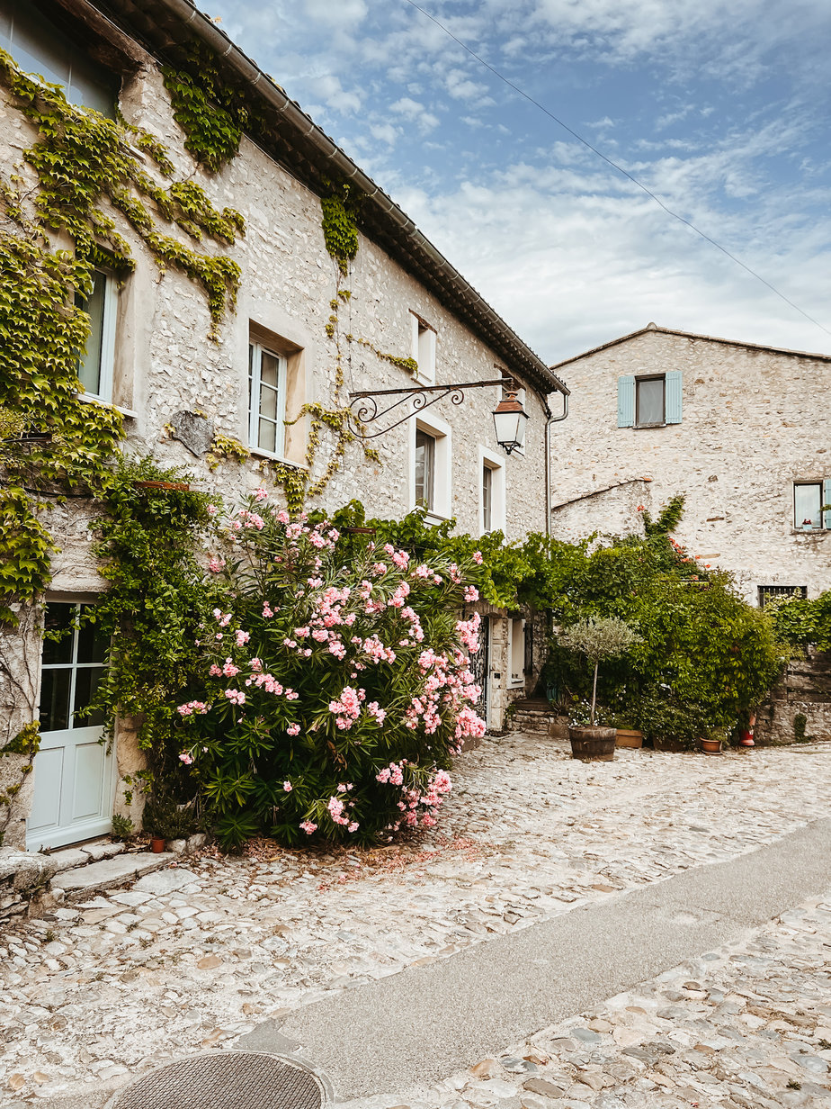 Provence travel Flowers and colorful shutters in Provence