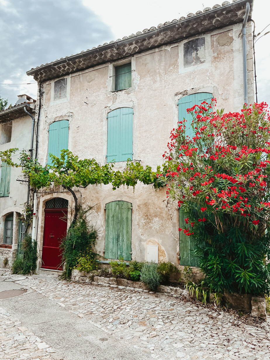 Vaison La Romaine Colorful shutters on a building in Provence - Vaison La Romaine
