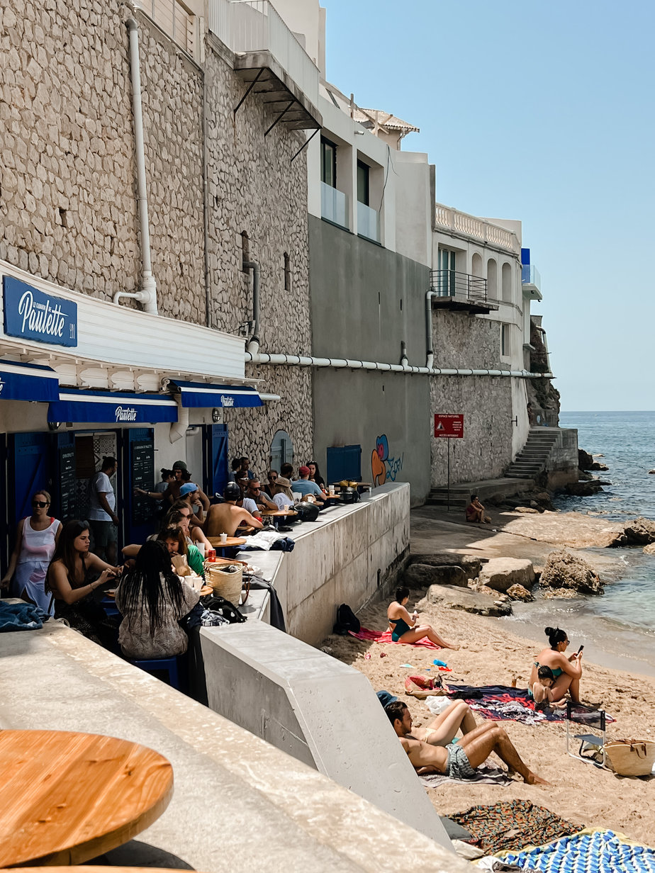 People sitting on the beach in Marseille