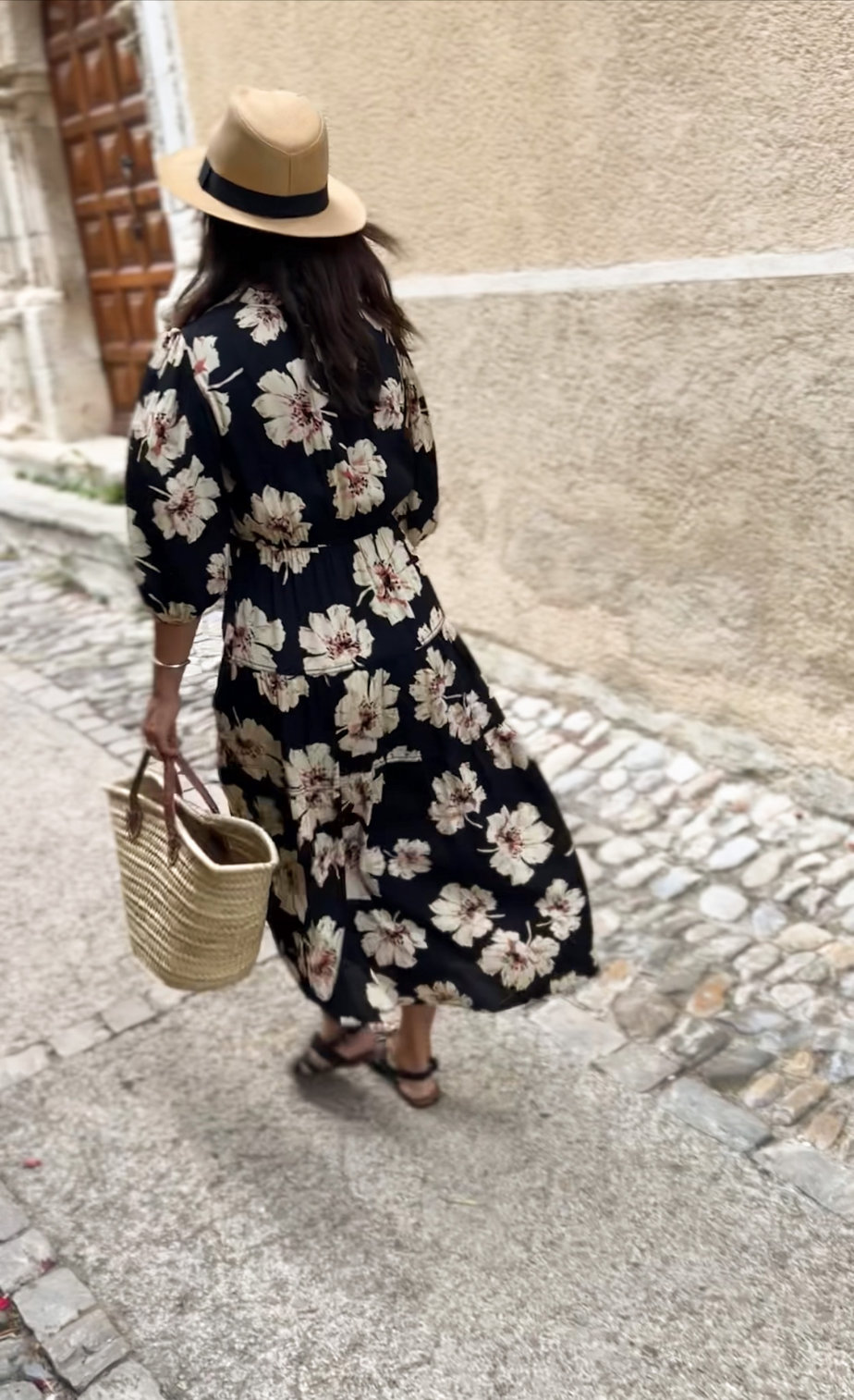 Black floral dress with market tote and hat in Gordes