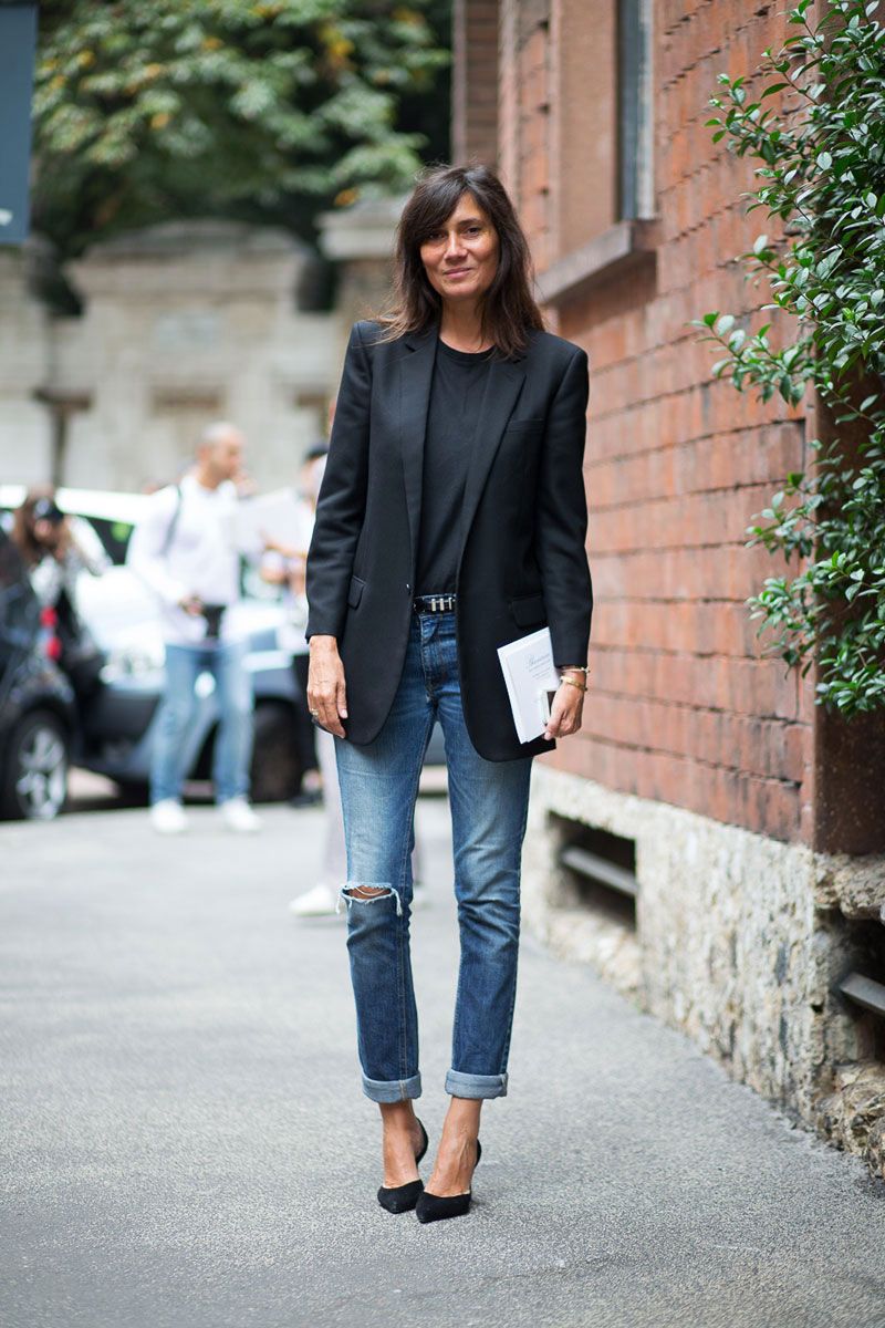 Emanuelle Alt on the street wearing a black blazer with jeans, and kitten heels.
